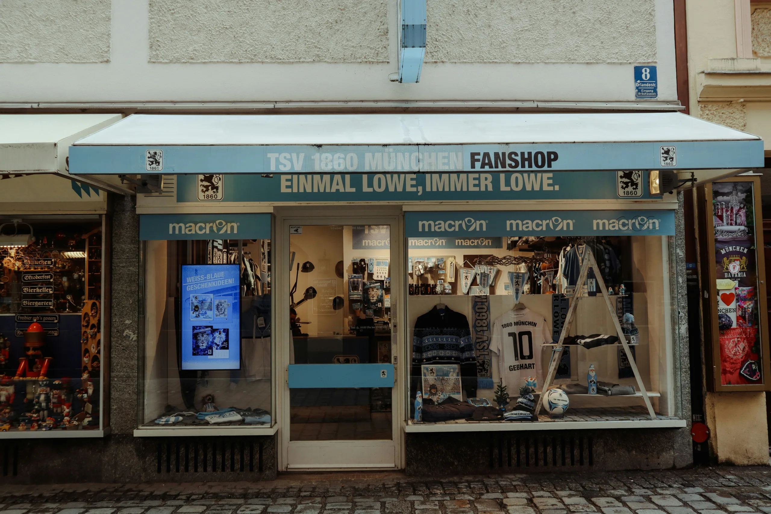 Real Madrid’s Stars Score the Goals, the Grit Gets Them Home a store front with a white awning and a blue and white awning
